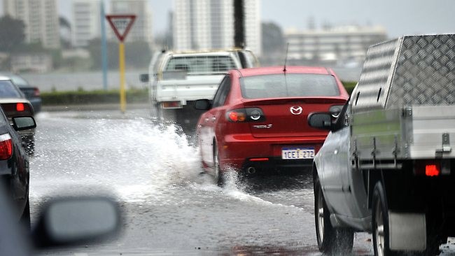 Cars driving in wet road