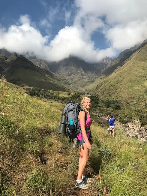 A lady going on a hike through the mountains