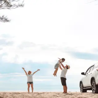 Family playing on the beach