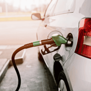 Fuel pumps in a vehicle to augment an article about car hire south africa in a volatile economy.