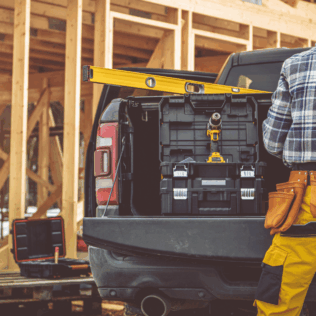 Bakkie in usage by a worker in construction that augments the article titled long term bakkie rental in South Africa